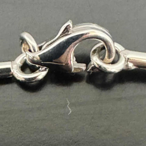 Gold necklace with diamond-set leaves