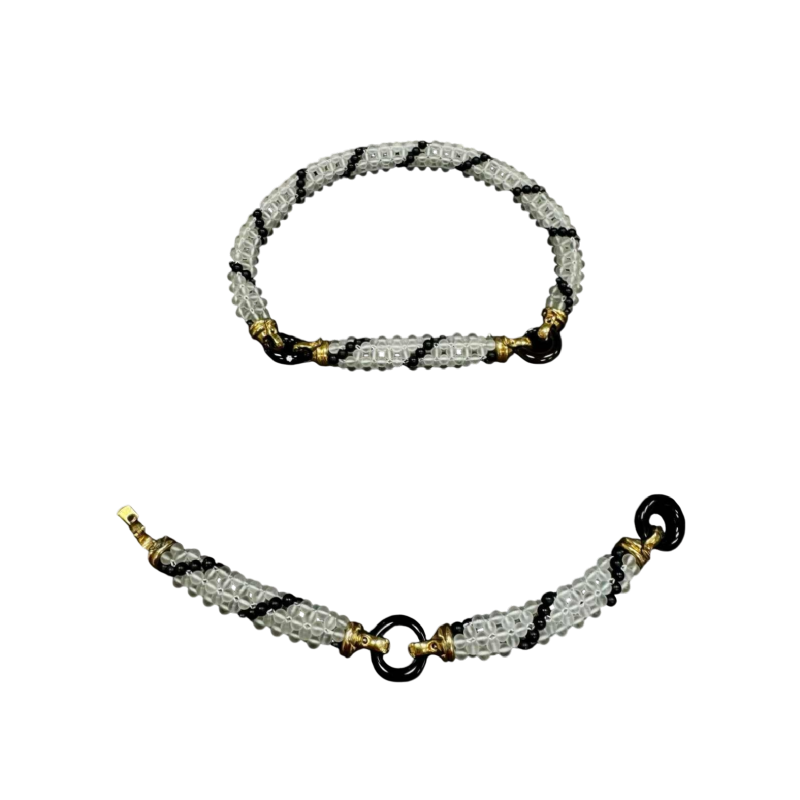 Gezet in 18-karaats geelgoud (collier & armband), bergkristal & zwarte onyx
