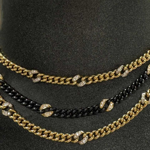 Collier en or jaune, acier noir avec diamants, 1983