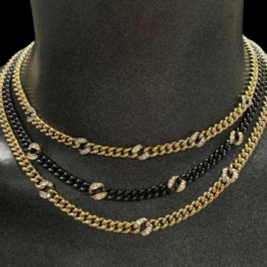 Collier en or jaune, acier noir avec diamants, 1983