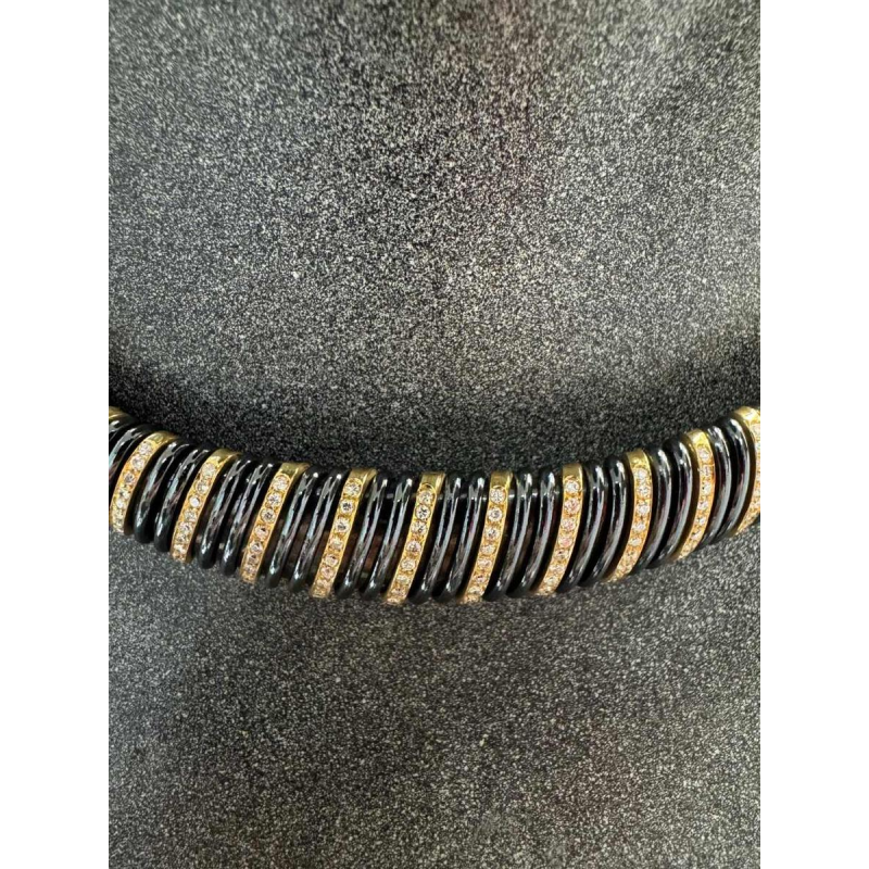 Necklace in yellow gold, black steel & diamonds