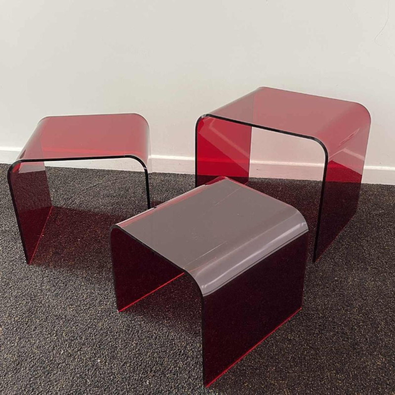 Set of 3 nesting tables in red methacrylate, ca 1970