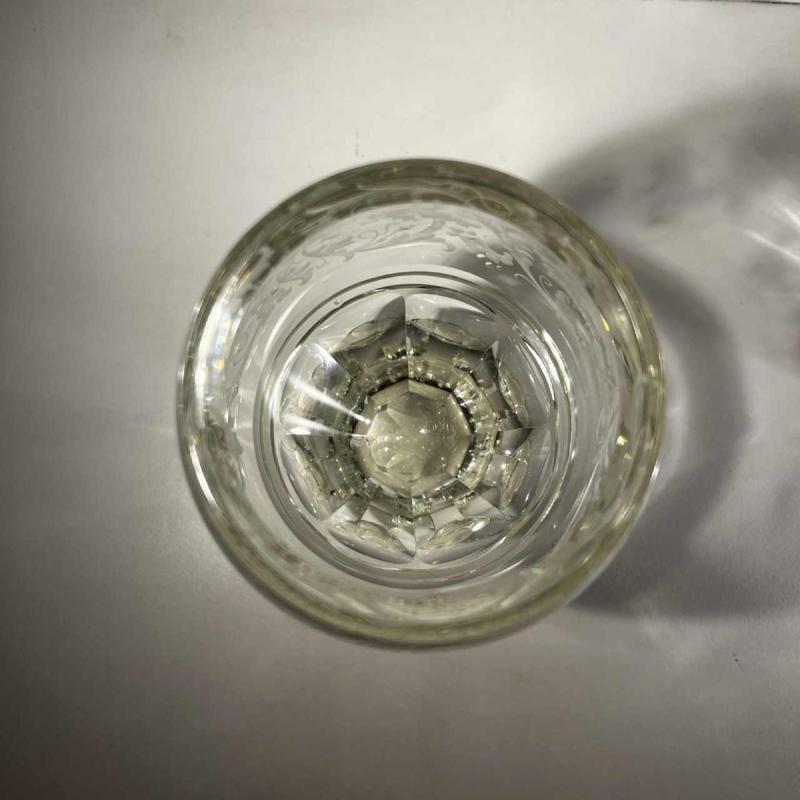 Pair of stemmed glasses in thick cut crystal with scrollwork and monogram decoration, Bohemia ca 1900