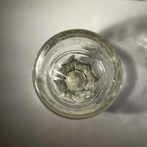 Pair of stemmed glasses in thick cut crystal with scrollwork and monogram decoration, Bohemia ca 1900