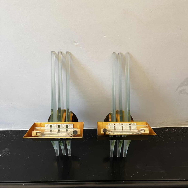 Pair of Hollywood Regency wall lights sconces, gilded brass bases & reflectors, thick glass panels, ca 1970