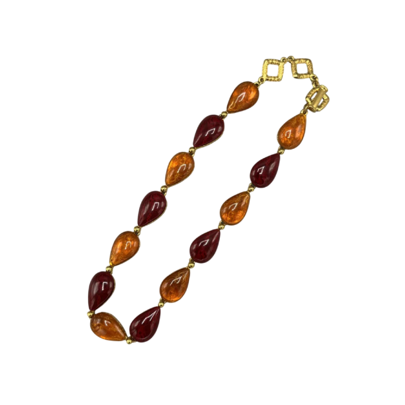Yves Saint Laurent, collier en métal doré et pate de verre orangé et bordeaux, fin XXe s