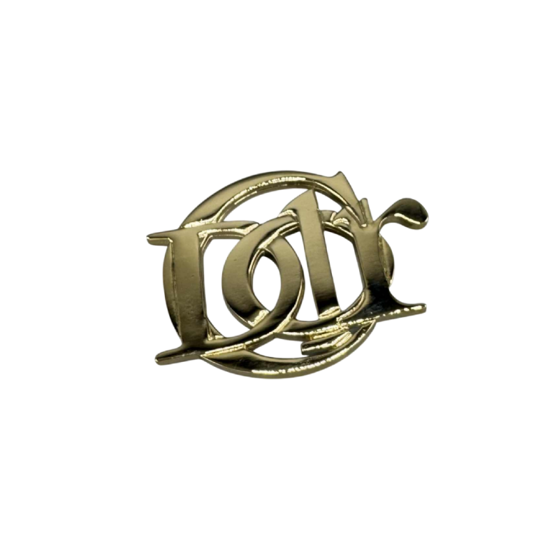 Christian Dior, broche logotype en métal doré, fin XXe s