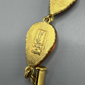 Yves Saint Laurent, necklace in gilt metal and orange and burgundy glass paste, late 20th c