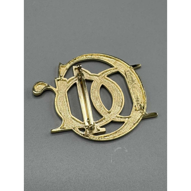 Christian Dior, broche logotype en métal doré, fin XXe s