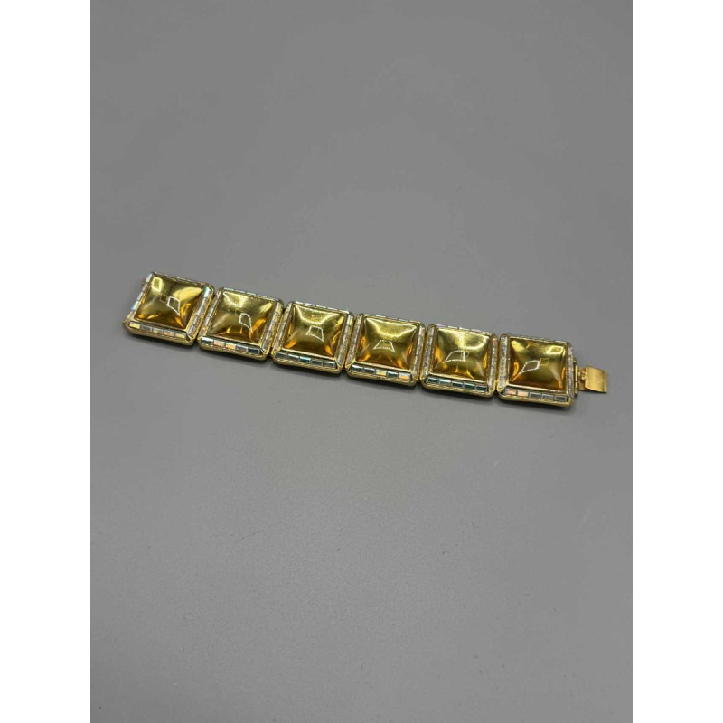 Yves Saint Laurent. Gold-plated metal bracelet, yellow glass paste, baguette-cut rhinestones