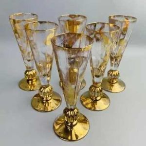 Jean-Paul van Lith in Biot, suite of six gilded crystal champagne flutes, 20th c