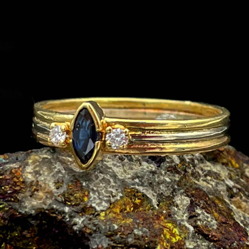 Marquise cut sapphire and diamond solitaire ring