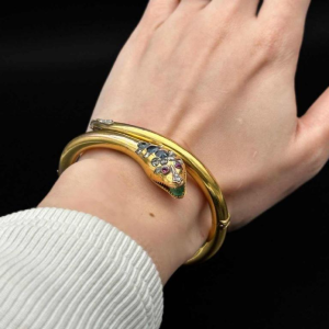 Belle époque snake bangle bracelet in gold, diamond, sapphires, emeralds, late 19th century