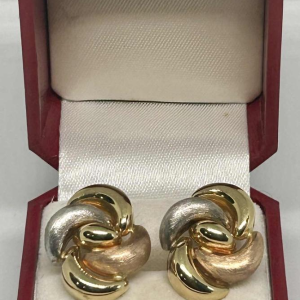 Pair of clip earrings in tricoloured gold