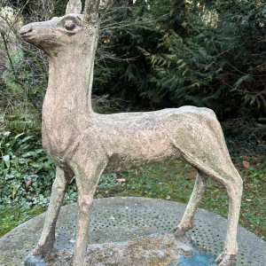 Garden sculpture in patinated cement representing a deer, mid-20th century