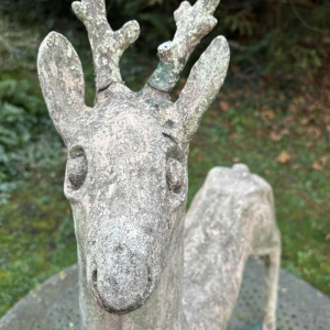 Garden sculpture in patinated cement representing a deer, mid-20th century