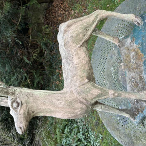Garden sculpture in patinated cement representing a deer, mid-20th century