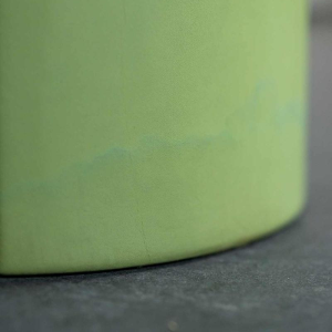 Set of 2 coffee tables, matcha green leather centre column, thick smoked plexiglass top