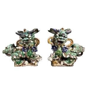 Pair of Fô dogs with prunus ribbons, Shiwan glazed stoneware, Southern China