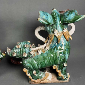 Pair of Fô dogs with prunus ribbons, Shiwan glazed stoneware, Southern China