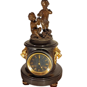 Jean-Baptiste REVILLON, Napoleon III clock with group of bronze putti, 19th c