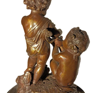 Jean-Baptiste REVILLON, Napoleon III clock with group of bronze putti, 19th c