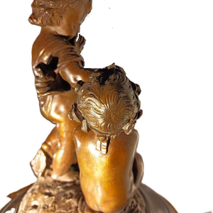 Jean-Baptiste REVILLON, Napoleon III clock with group of bronze putti, 19th c