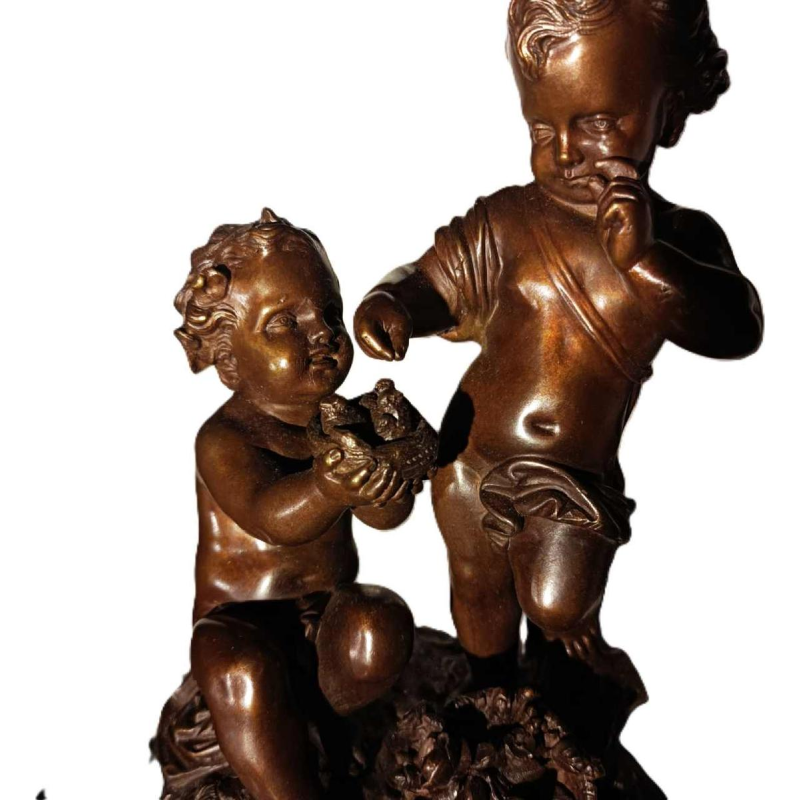 Jean-Baptiste REVILLON, Napoleon III klok met groep bronzen putti, 19de eeuw