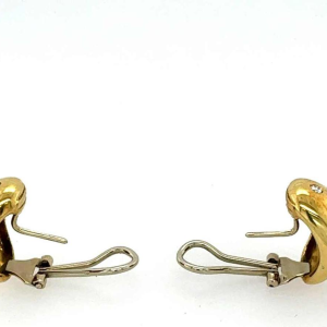 Paar gouden oorbellen bezet met diamanten en granaten