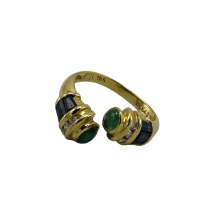 Bague 'toi et moi' en or jaune 18 K sertie de saphirs et cabochons d'émeraudes