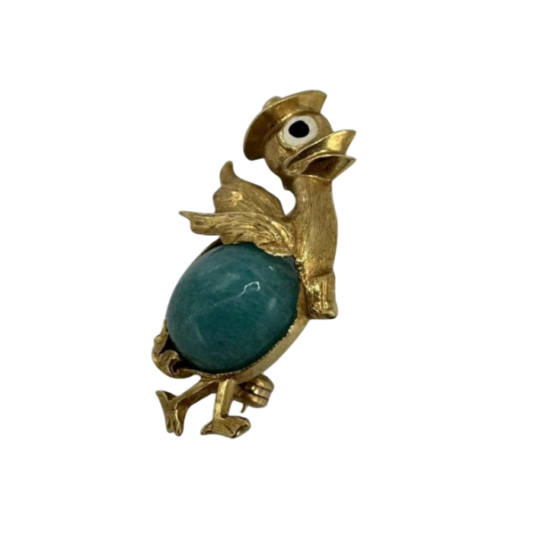 Petite broche en or jaune 18 carats sertie d'une turquoise. Années 1970