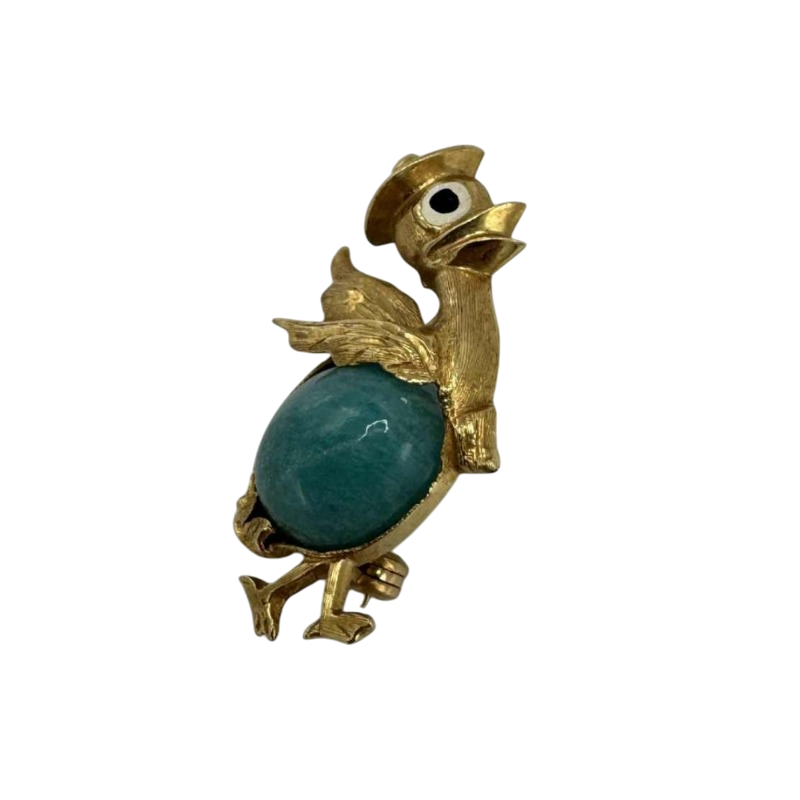 Petite broche en or jaune 18 carats sertie d'une turquoise. Années 1970