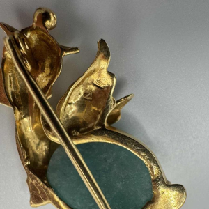 Small brooch in 18k yellow gold set with a turquoise stone. Circa 1970