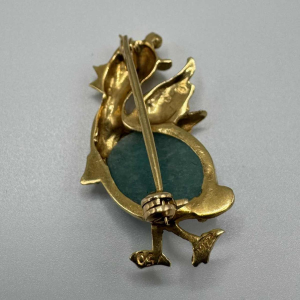 Small brooch in 18k yellow gold set with a turquoise stone. Circa 1970