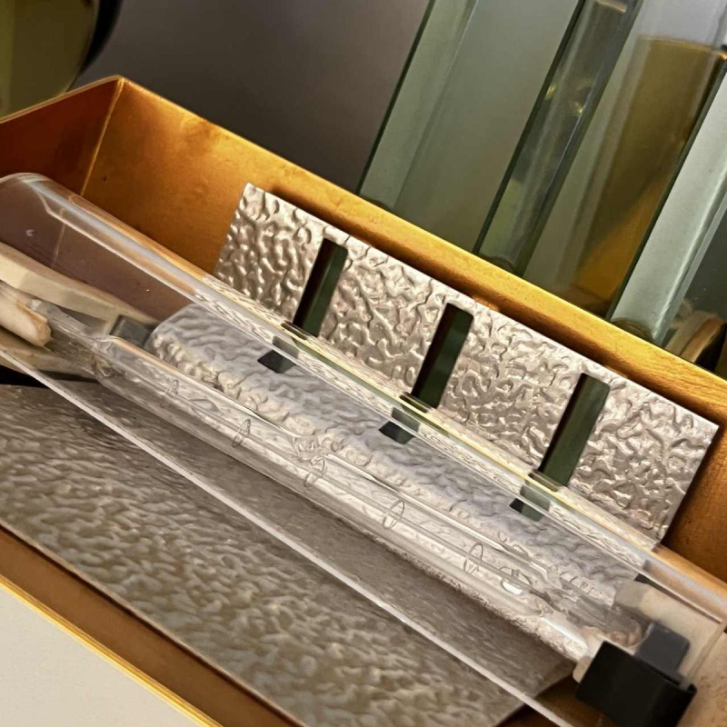 Pair of Hollywood Regency wall lights sconces, gilded brass bases & reflectors, thick glass panels, ca 1970