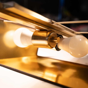 DEKNUDT, pair of gilded brass sconces / wall light, Hollywood Regency style, ca 1970