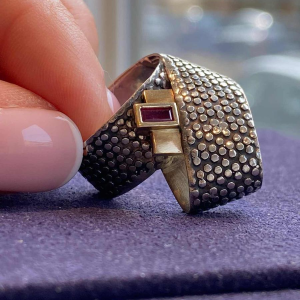 Janine Renard, modernist gold and silver ‘Ruban’ ring, emerald-cut ruby