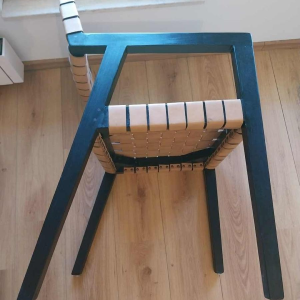 Olivier de Schrijver ‘Boss’ pair of armchairs, blackened wood and leather straps