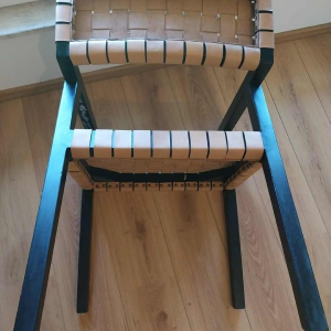 Olivier de Schrijver ‘Boss’ pair of armchairs, blackened wood and leather straps