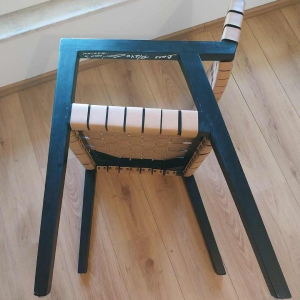 Olivier de Schrijver “Boss“ paire de fauteuils, bois noirci et lanières de cuir