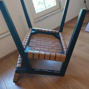 Olivier de Schrijver ‘Boss’ pair of armchairs, blackened wood and leather straps