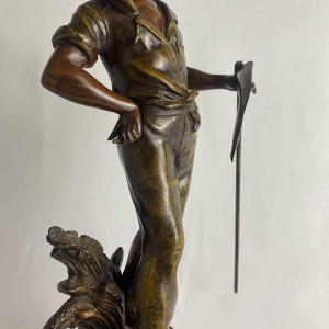 Auguste Moreau Farmer with a scythe sculpture in regula with green patina, ca 1900
