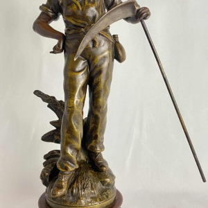 Auguste Moreau Farmer with a scythe sculpture in regula with green patina, ca 1900