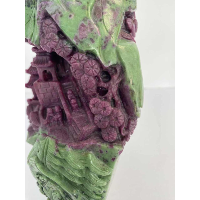 Rock carved from zoisite ruby depicting a lively Asian landscape