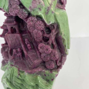 Rock carved from zoisite ruby depicting a lively Asian landscape