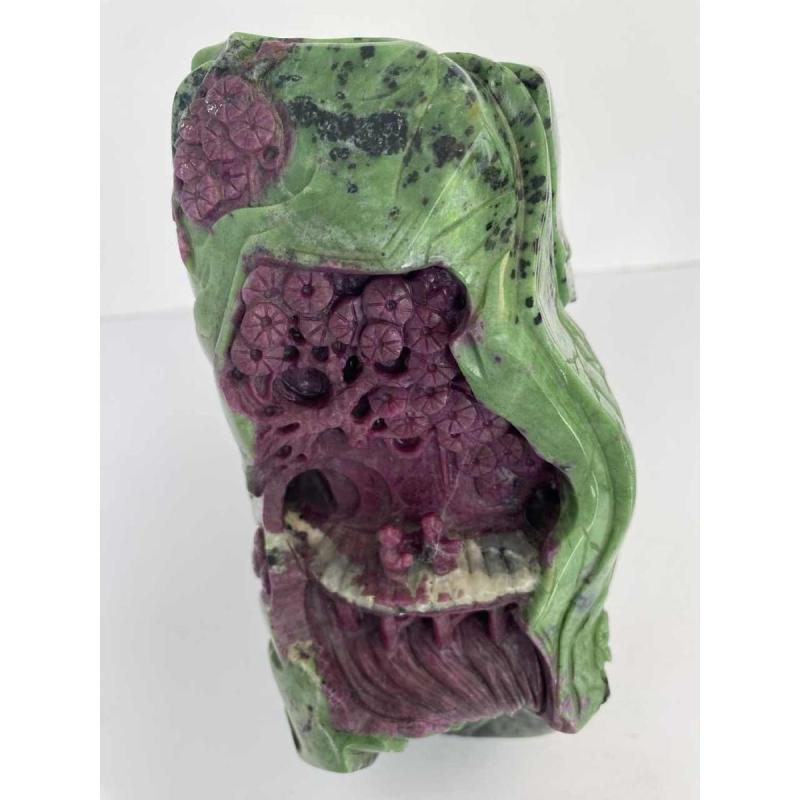 Rock carved from zoisite ruby depicting a lively Asian landscape