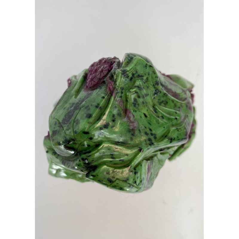 Rock carved from zoisite ruby depicting a lively Asian landscape