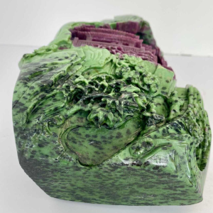 Rock carved from zoisite ruby depicting a lively Asian landscape