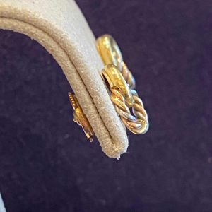 Three gold earrings, ca 1980