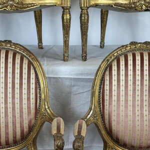 Suite of four medallion-back armchairs, carved gilt wood, 19th c